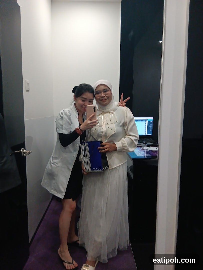 Two individuals posing in an indoor setting