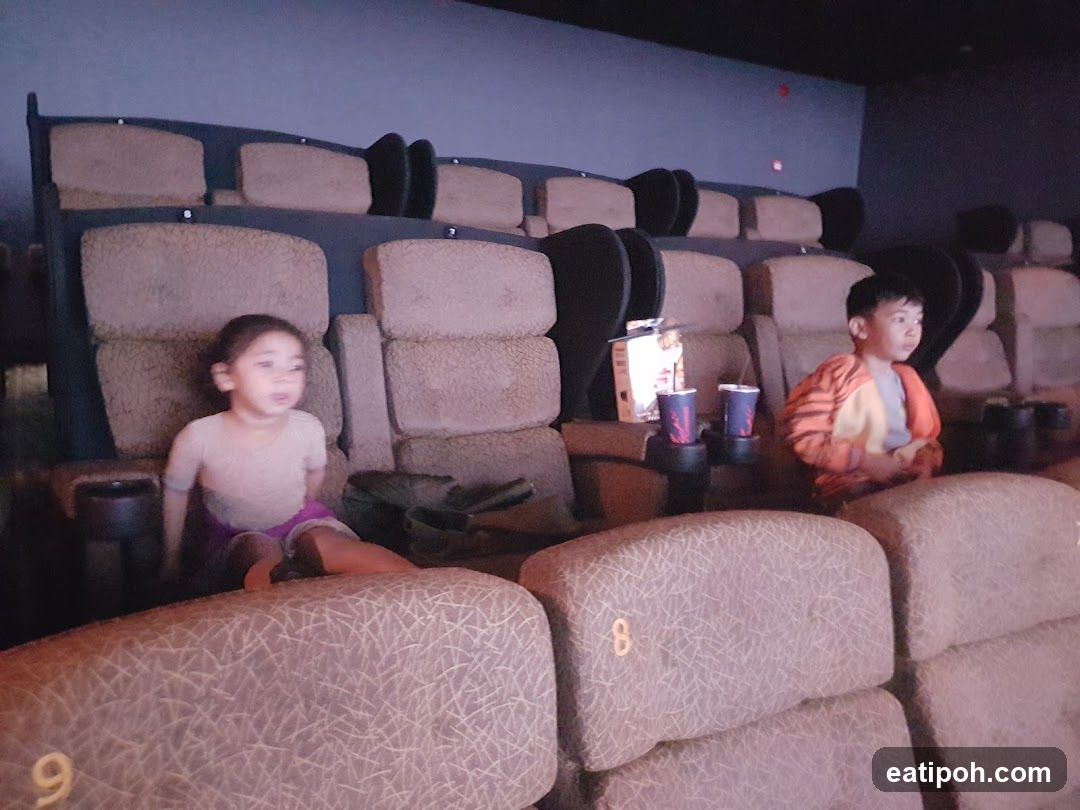 Children in movie theater seating