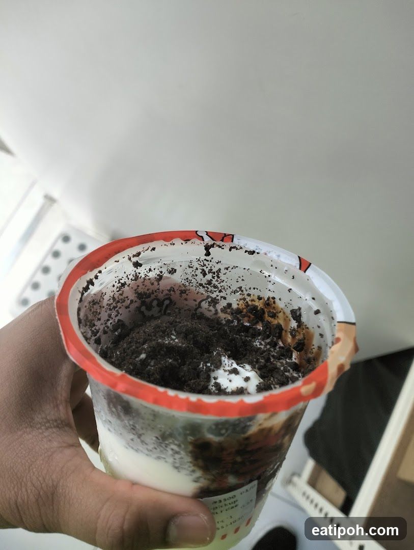 Hand holding dessert cup