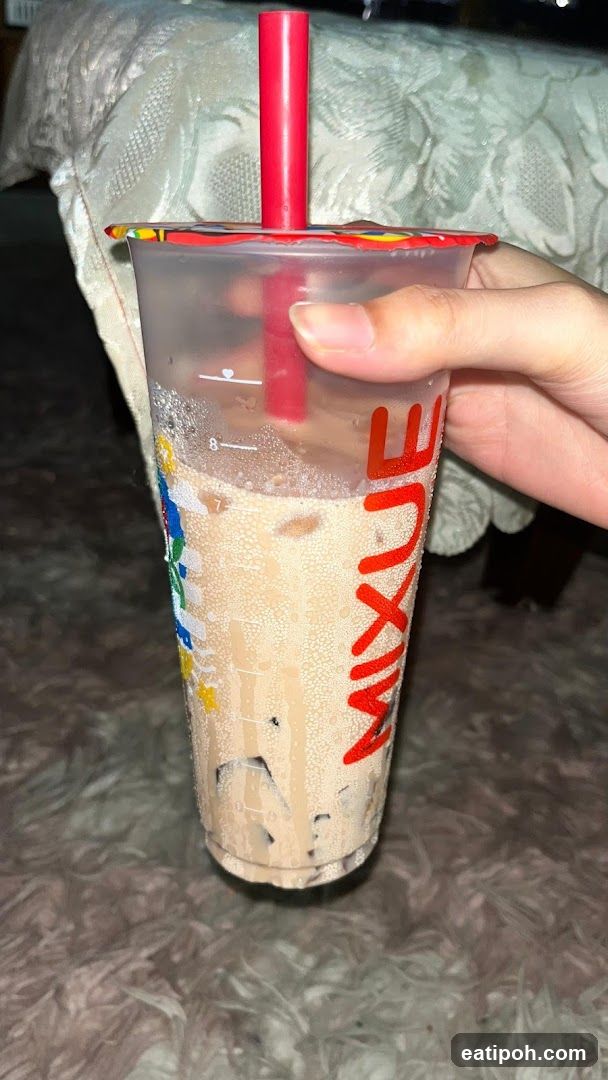 Hand holding a drink cup