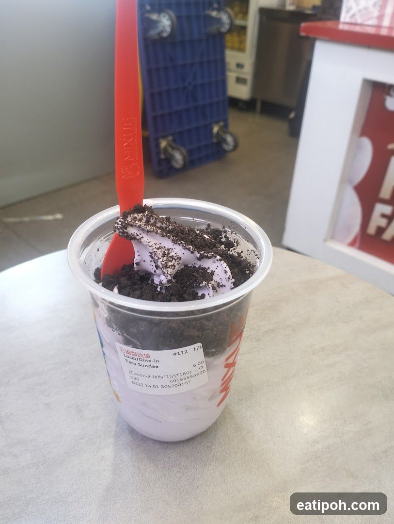 Taro Sundae in a cup with red spoon