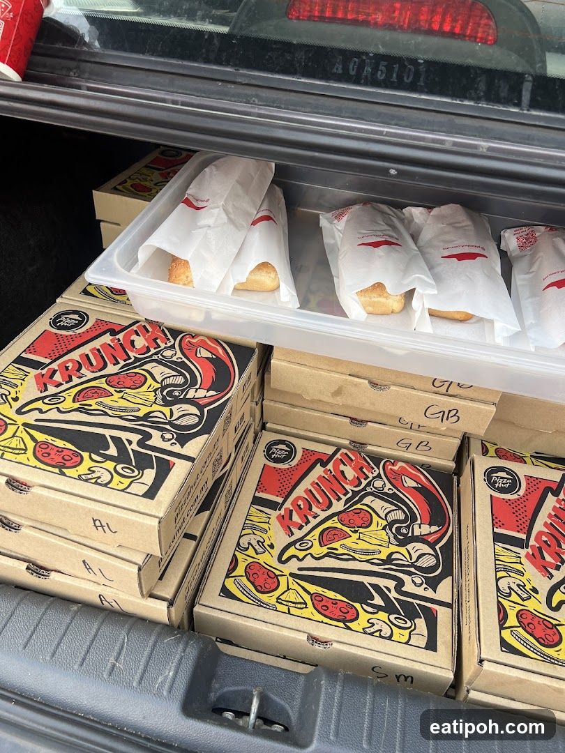 Car trunk with Pizza Hut Krunch boxes
