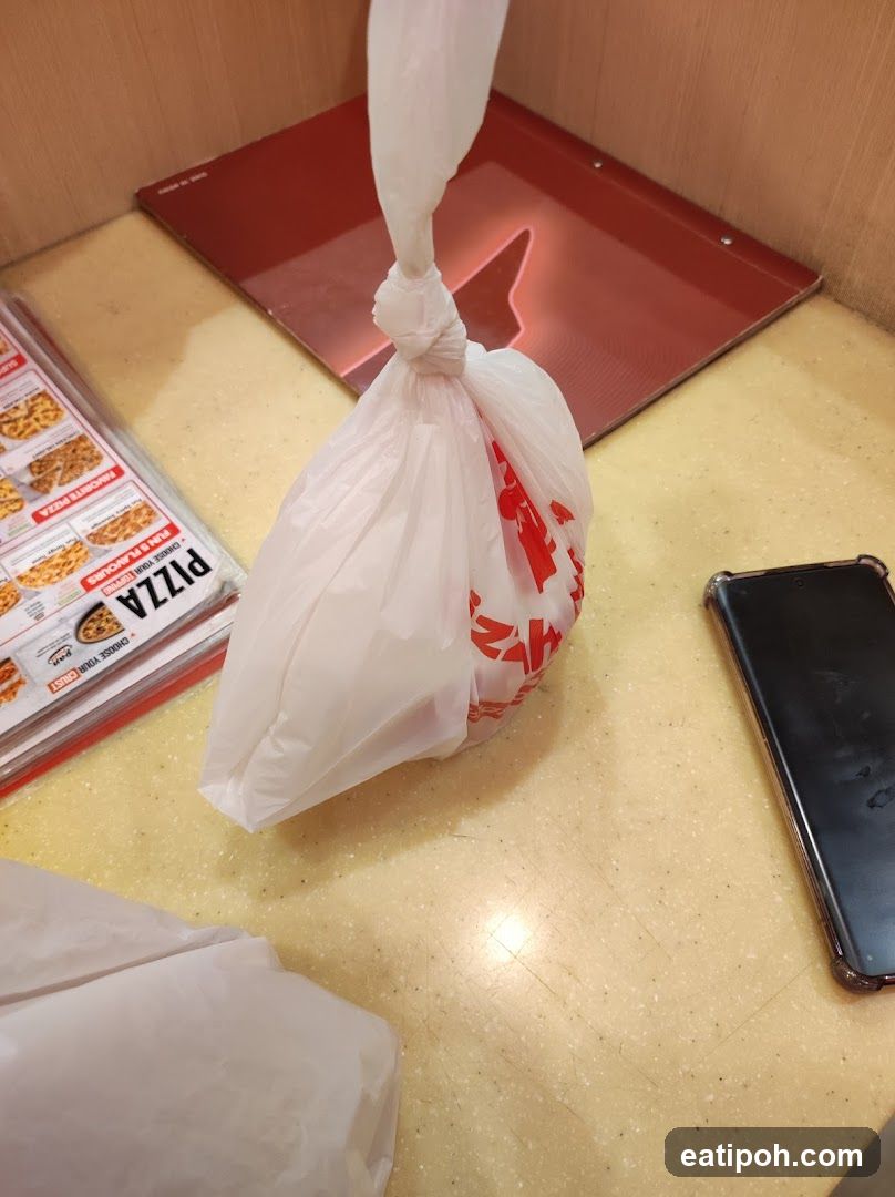 Counter with food bag and phone