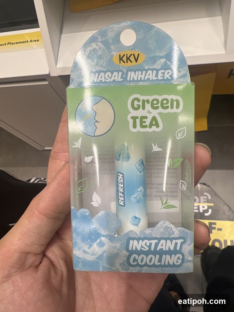 Hand holding nasal inhaler package