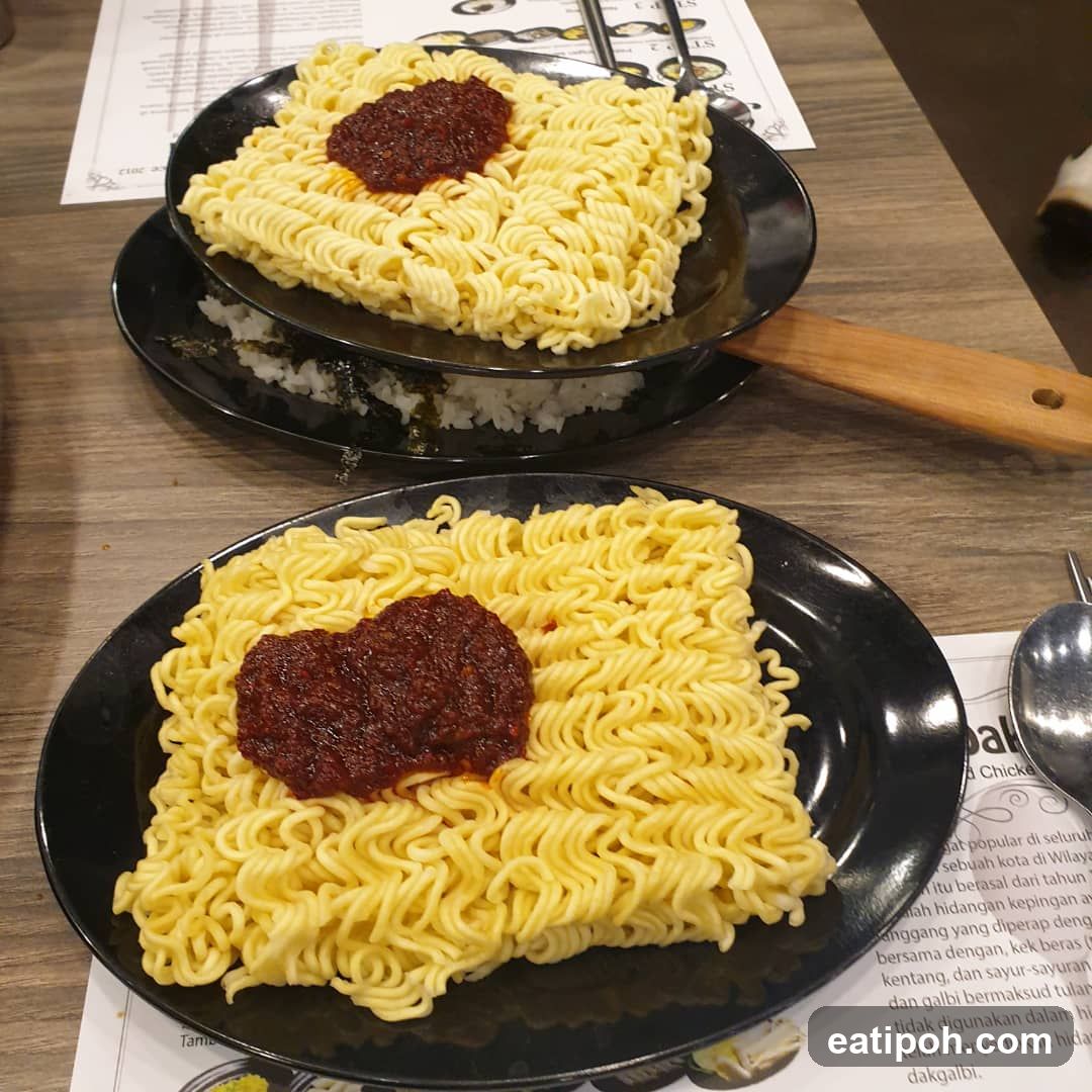 Noodles with Sauce on Black Plates