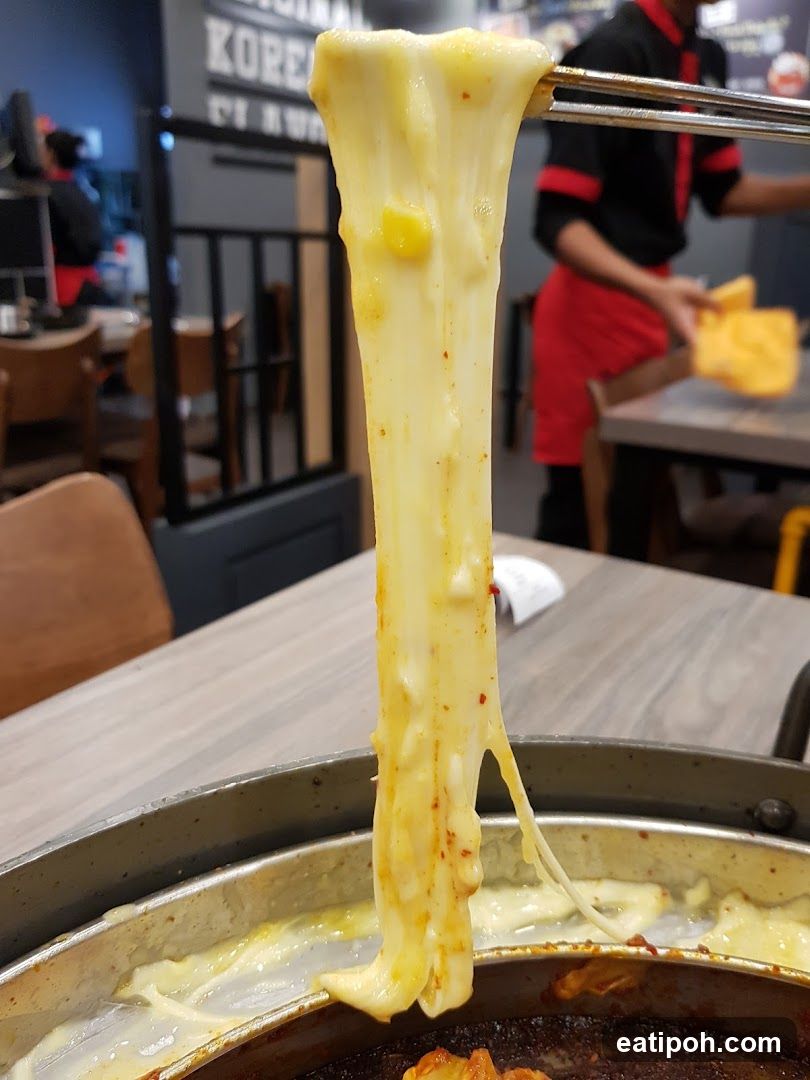 Cheese Pull in Restaurant Interior