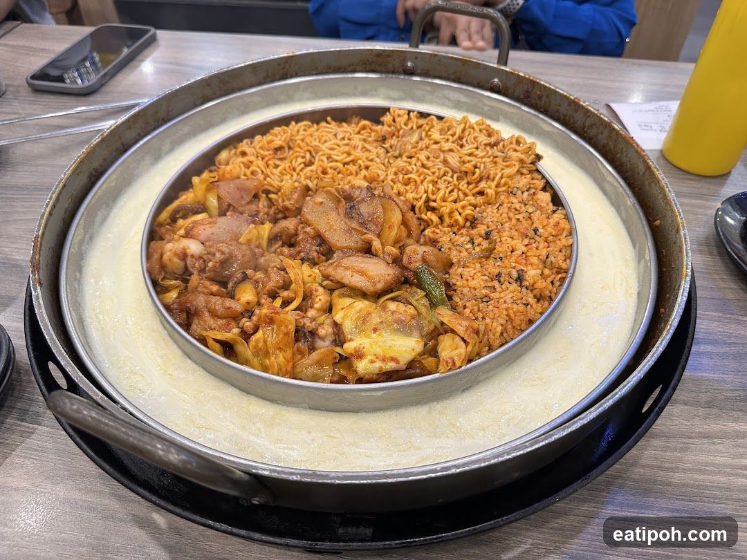 Food served in a multi-compartment hot pot