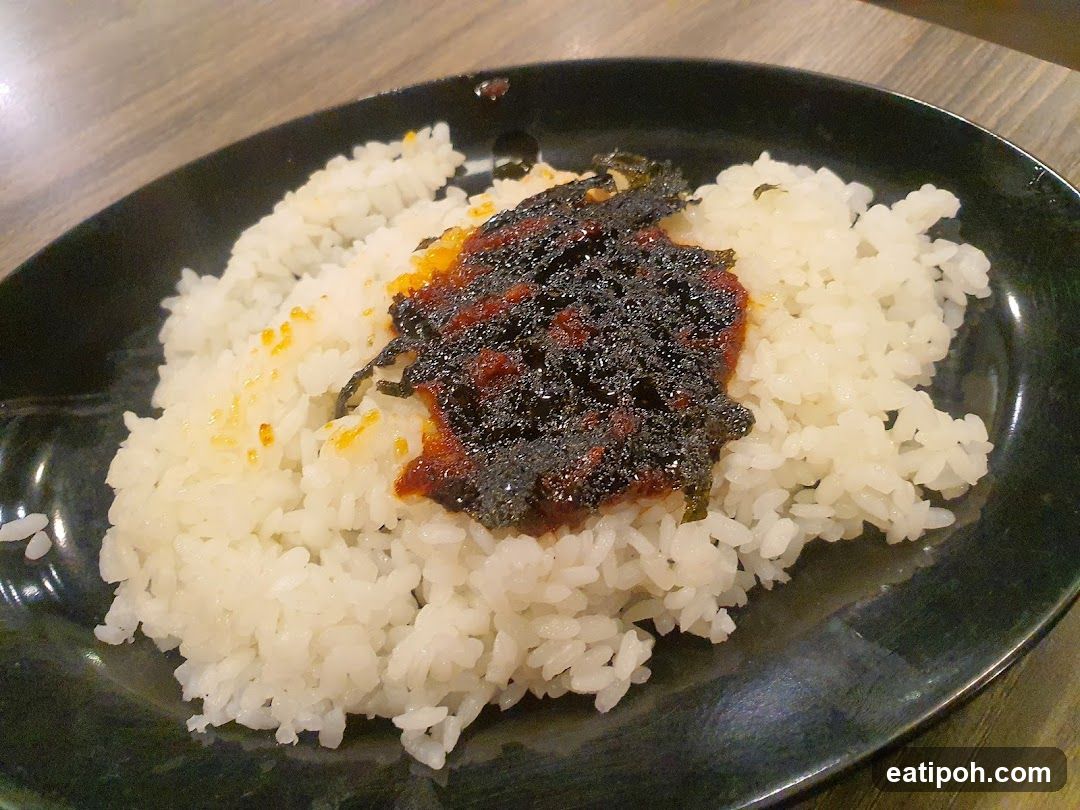 Rice dish on black plate