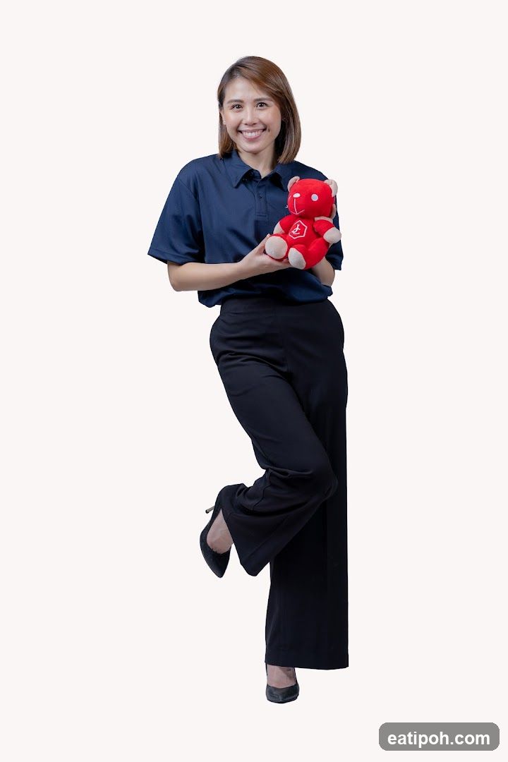 Staff Member Holding Branded Merchandise