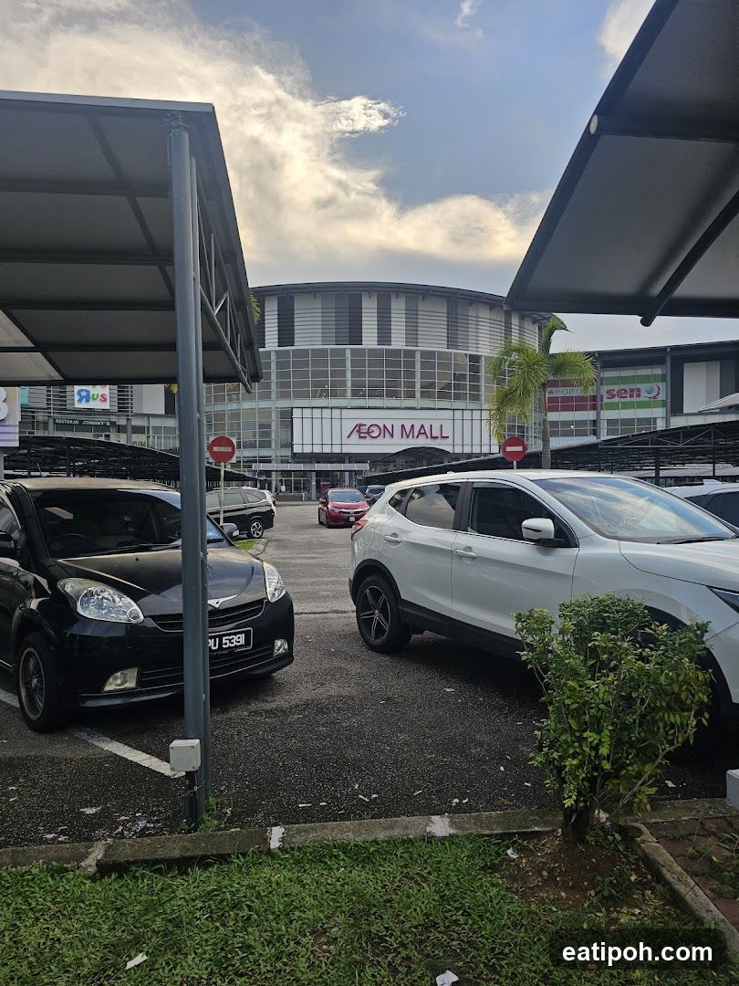 Parking lot with mall in background