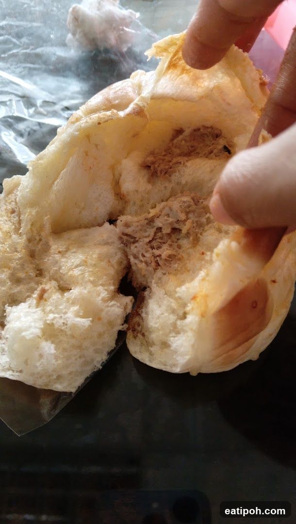 Bread being held open