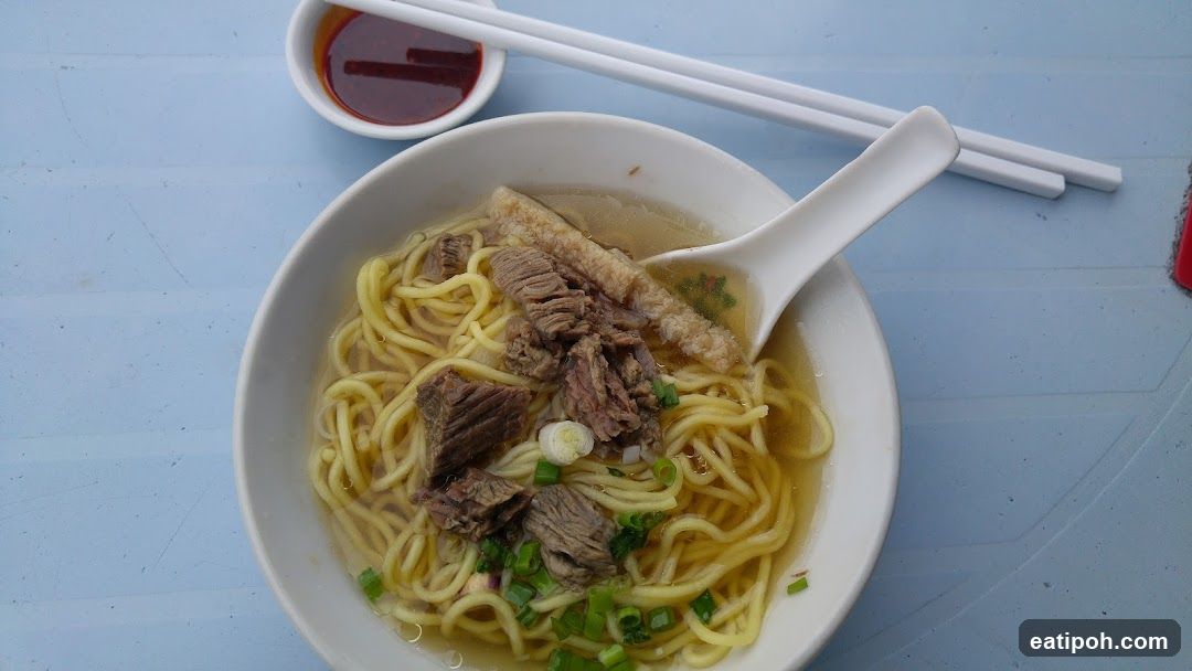 Noodle Bowl with Sauce and Chopsticks