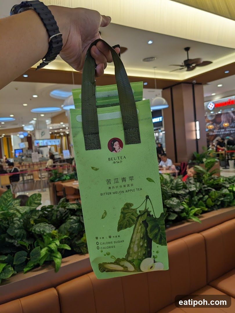 Hand holding tea bag in shopping mall