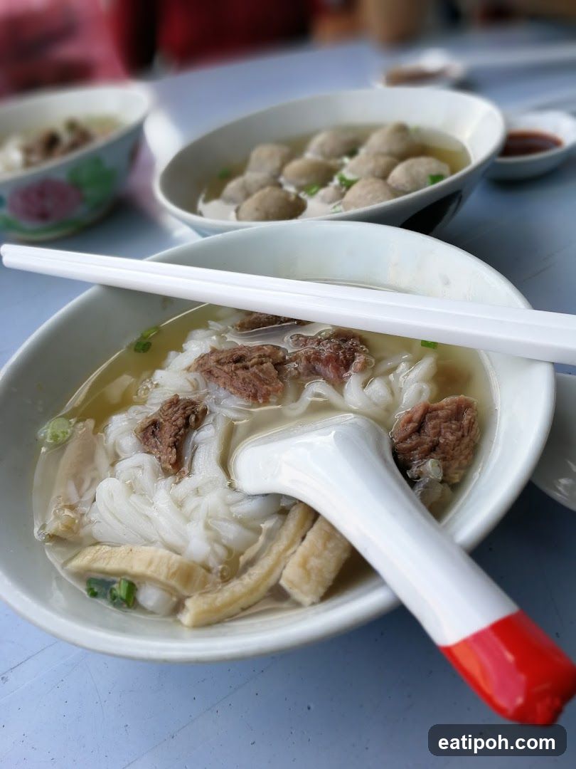 Bowl of Noodle Soup with Meatballs