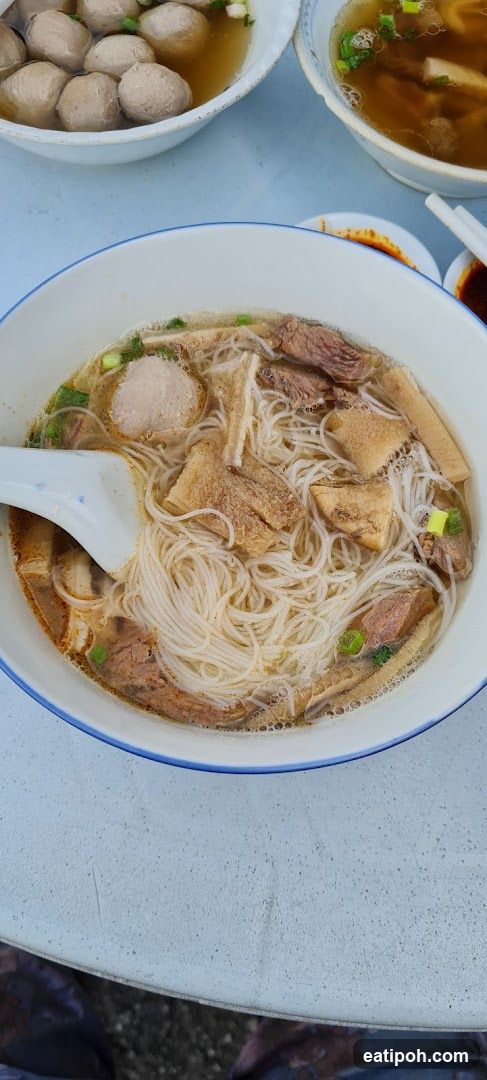 Bowl of Noodle Soup with Meatballs and Tofu