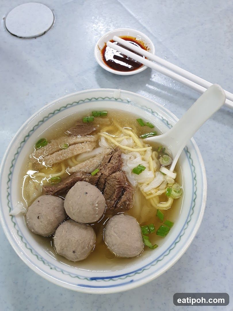 Bowl of Noodle Soup with Meatballs and Beef