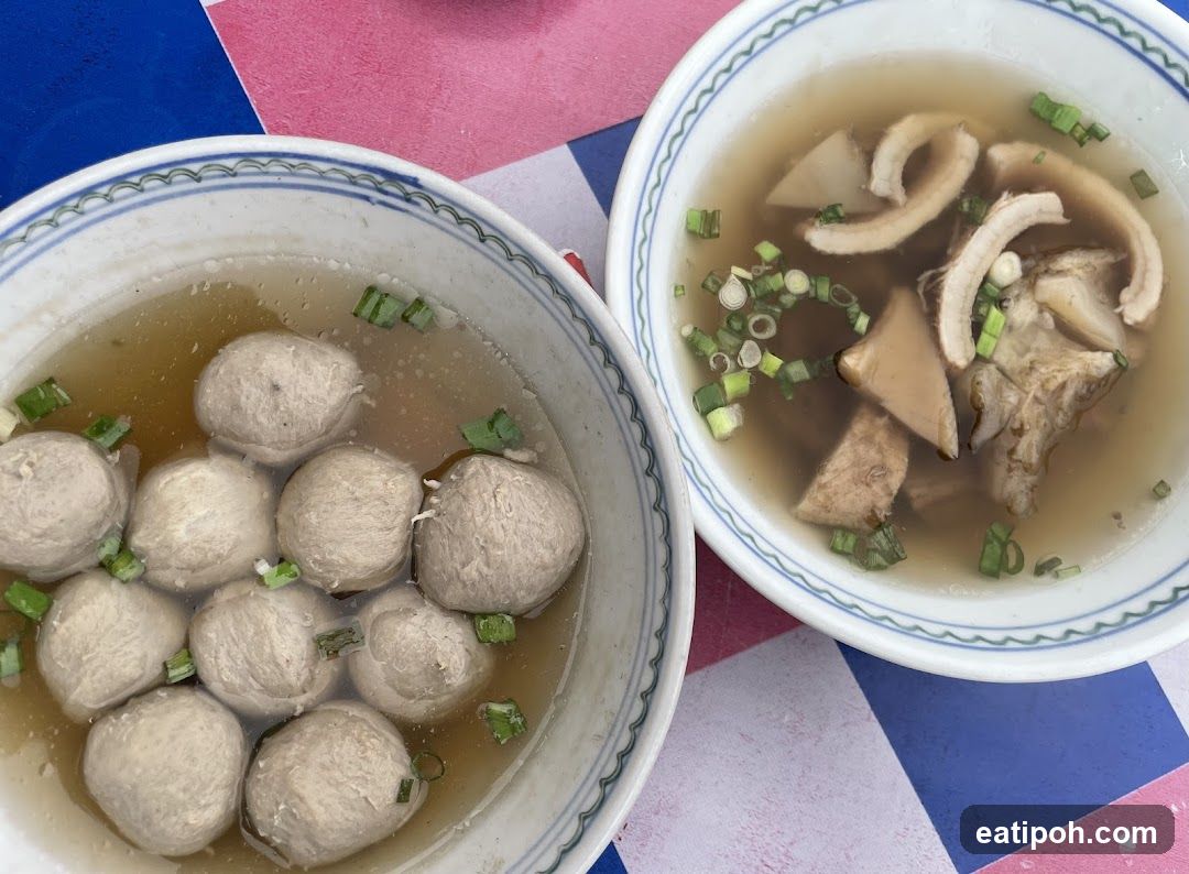 Two bowls of soup on a colorful tablecloth