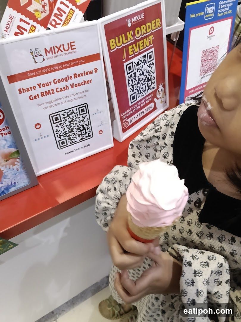 Customer with ice cream at Mixue store