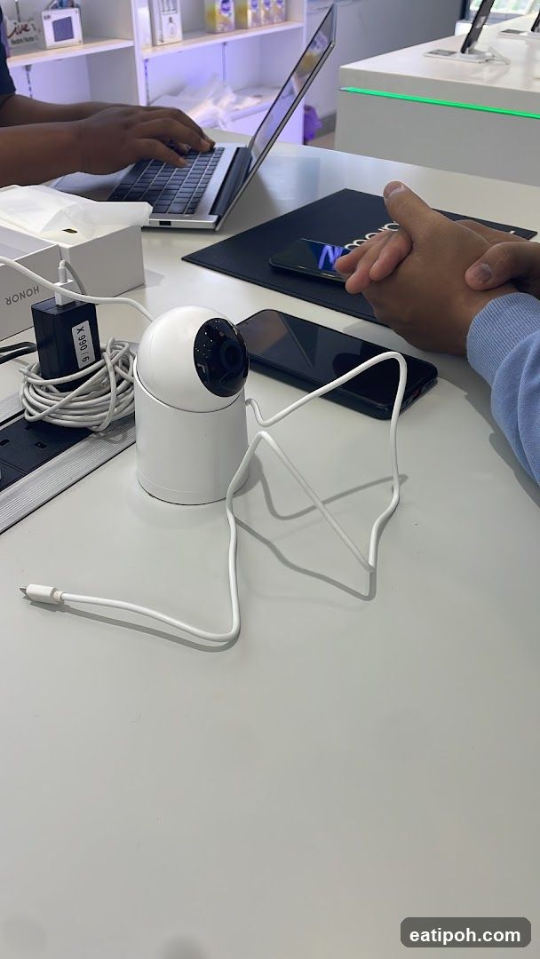 Table with electronics and people