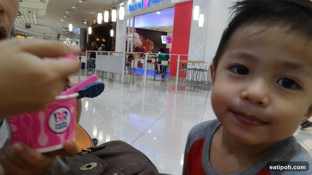 Child in shopping mall interior