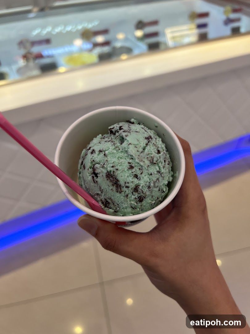 Hand holding ice cream cup