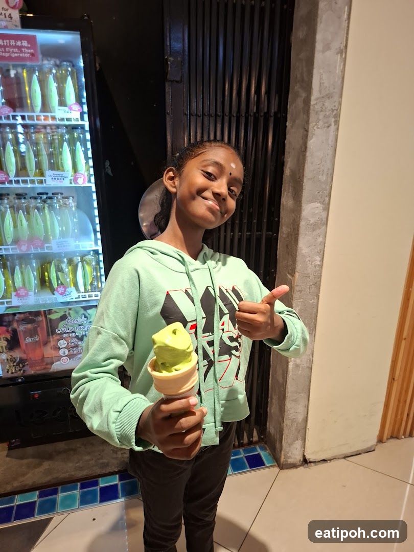 Girl holding ice cream in store