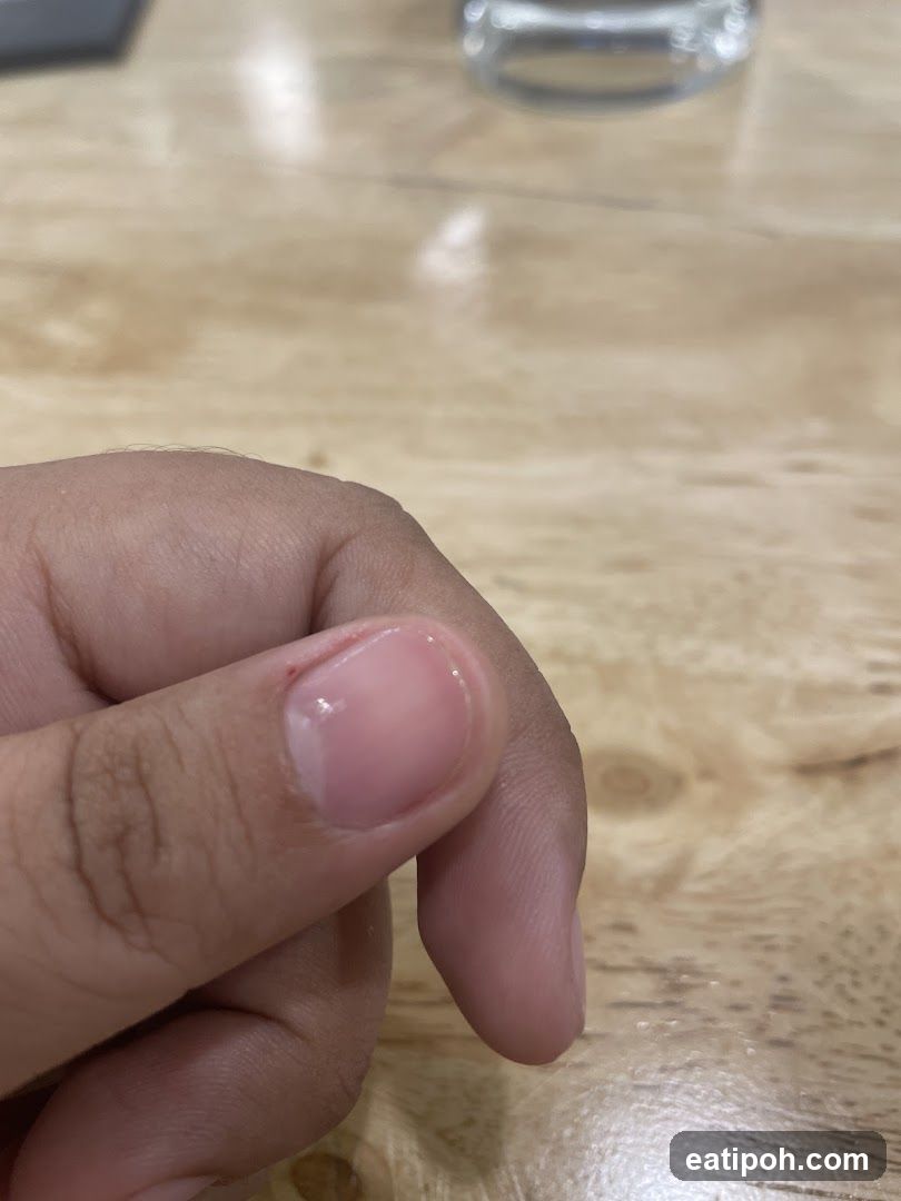 Hand on wooden surface