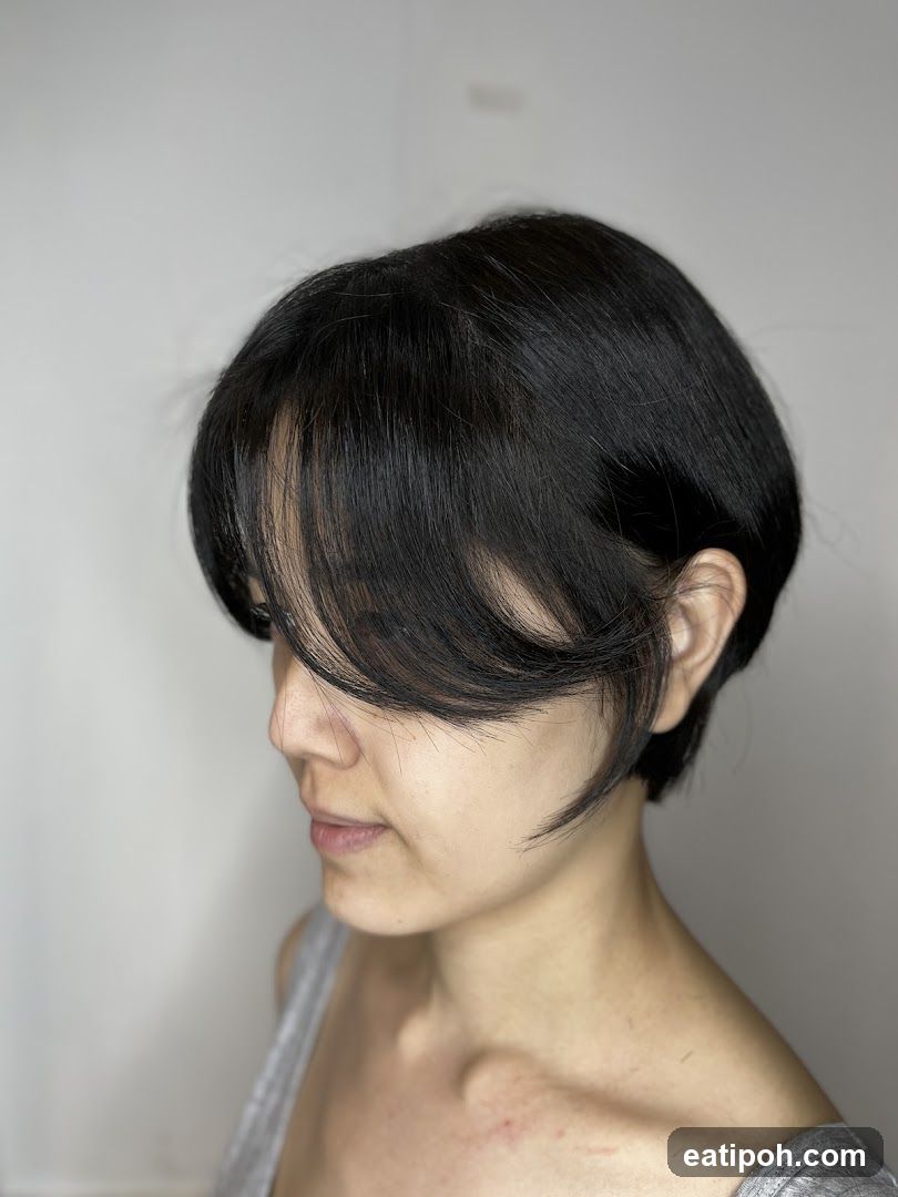 Profile of a person with short black hair