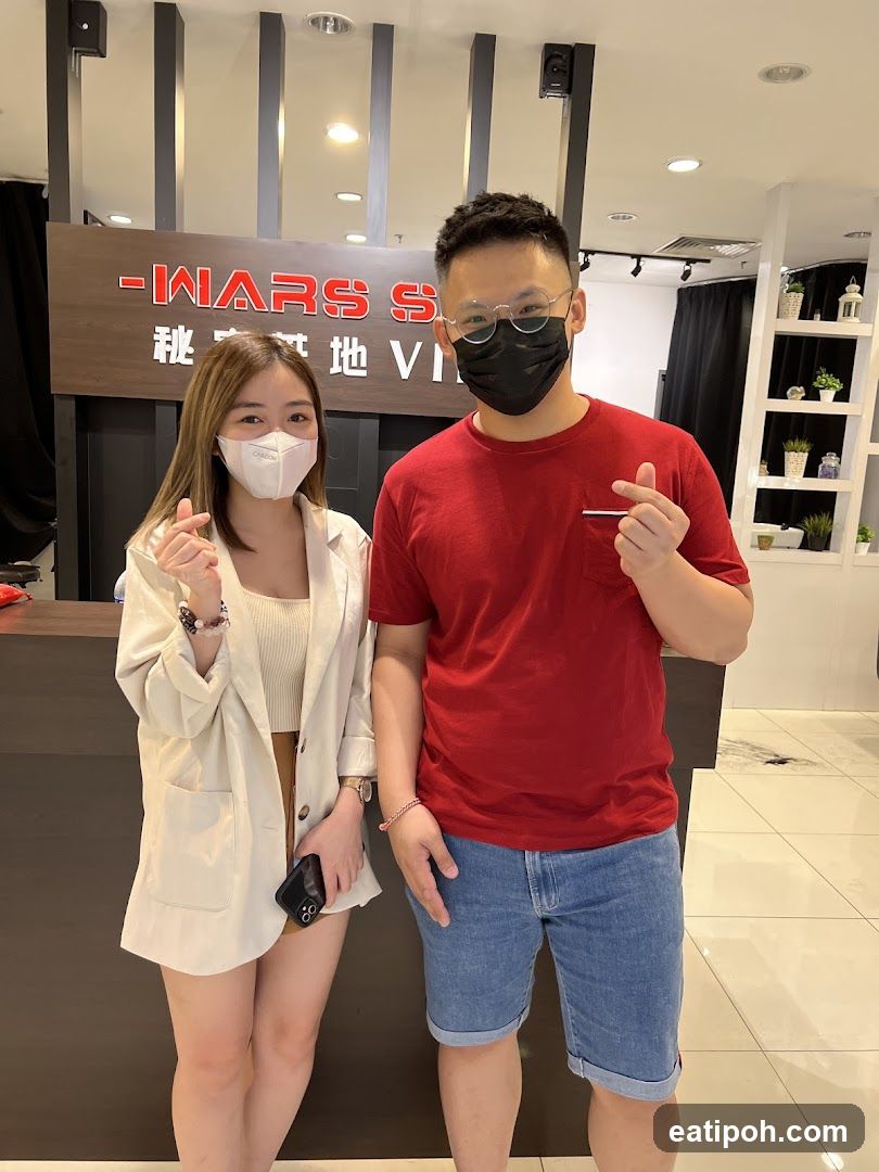 Two individuals posing indoors