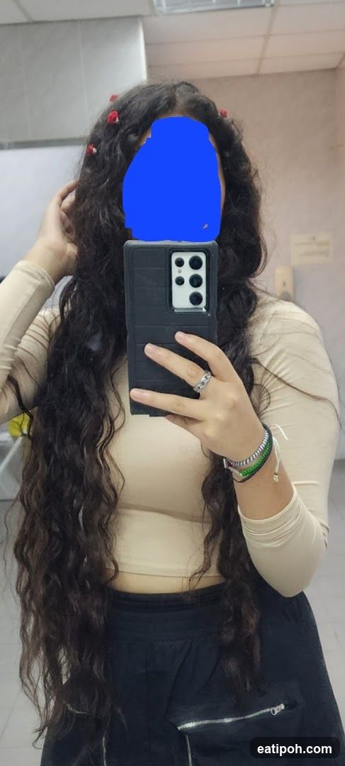 Mirror selfie in indoor setting