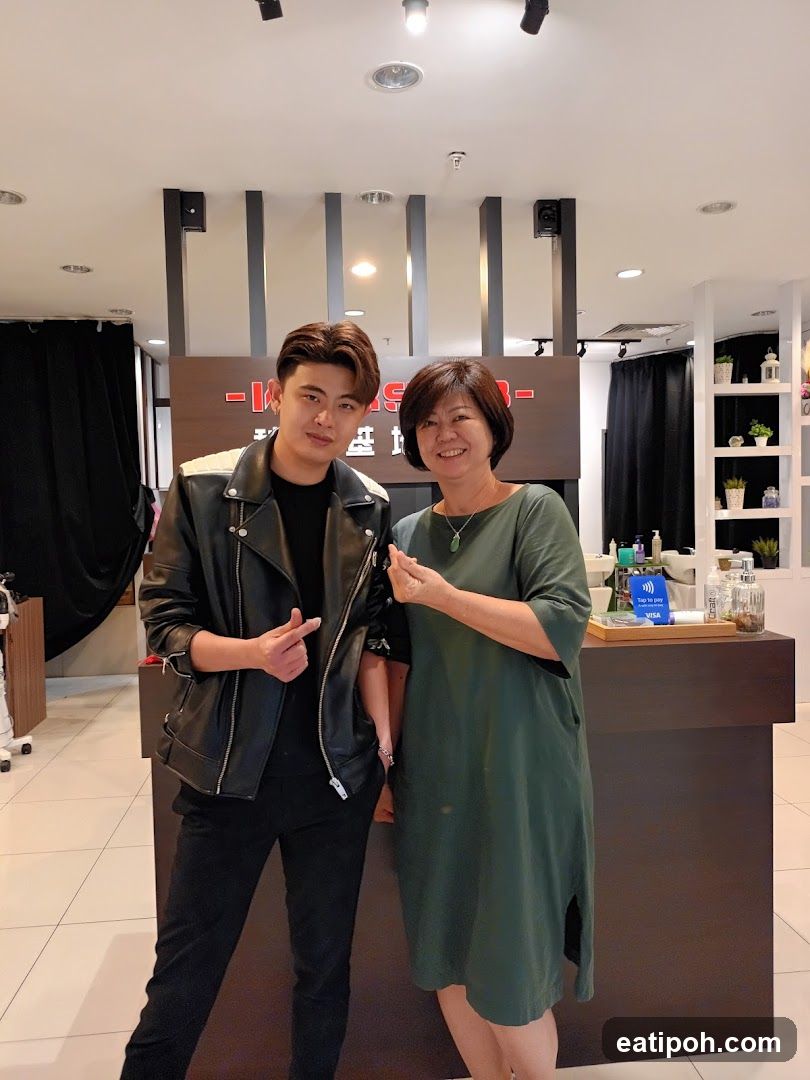 Two people posing inside a business
