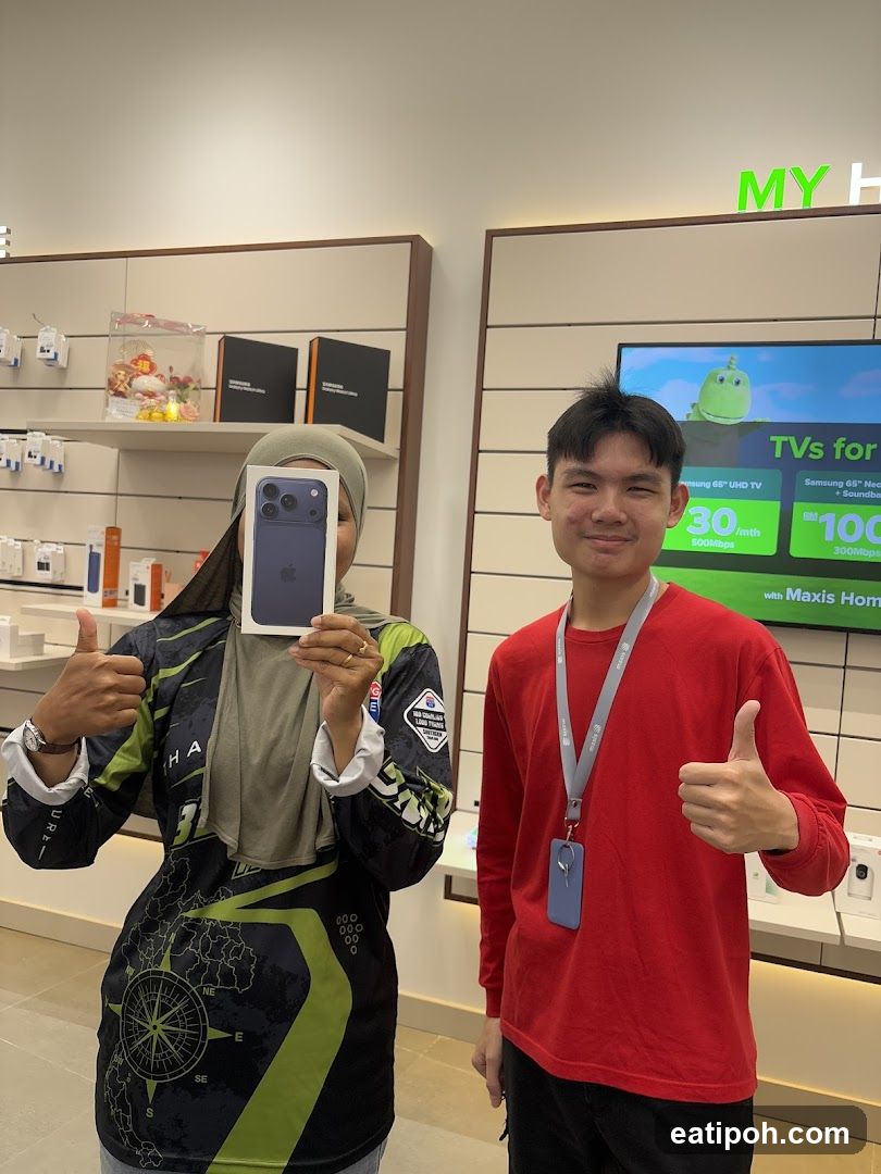 Two individuals in electronics store