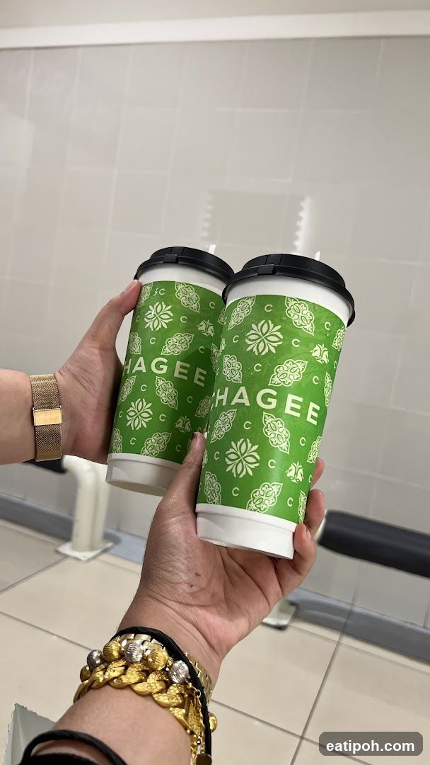 Hagee Coffee Cups Held in Hands