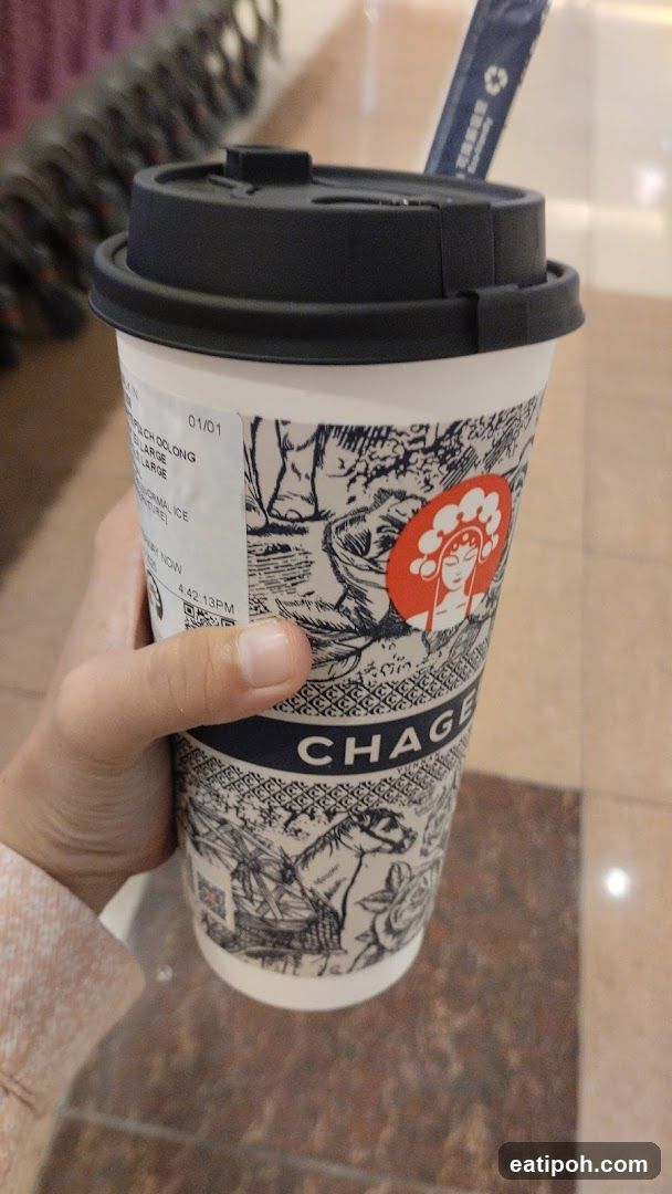Hand holding a beverage cup