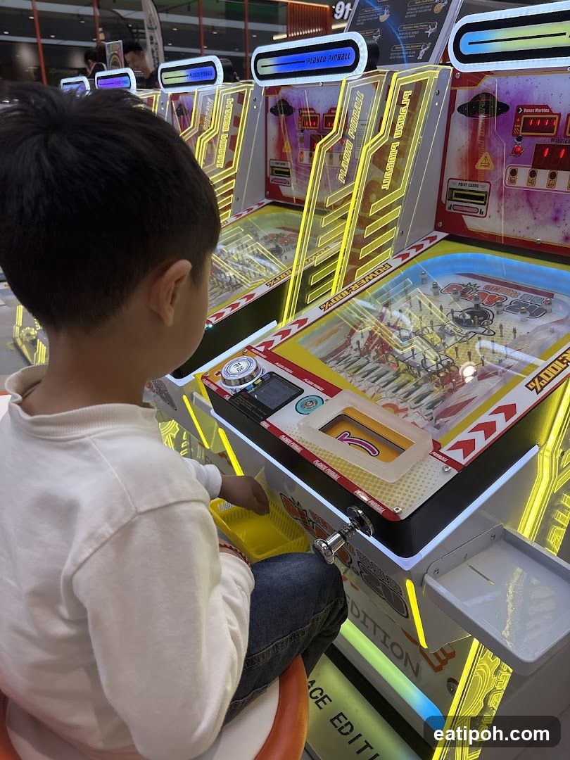 Child playing arcade game
