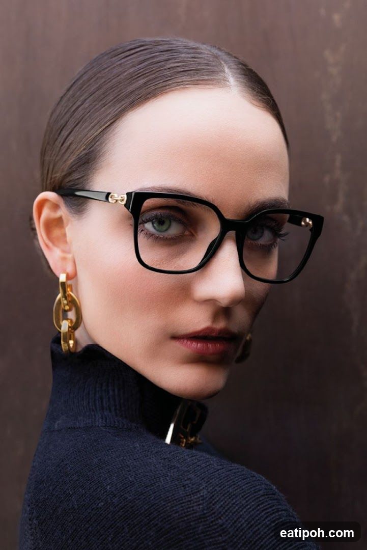 Portrait of a woman wearing glasses and earrings