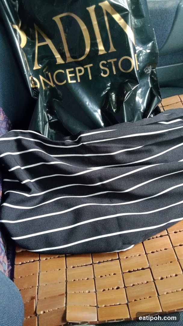 Shopping Bag and Clothing Item