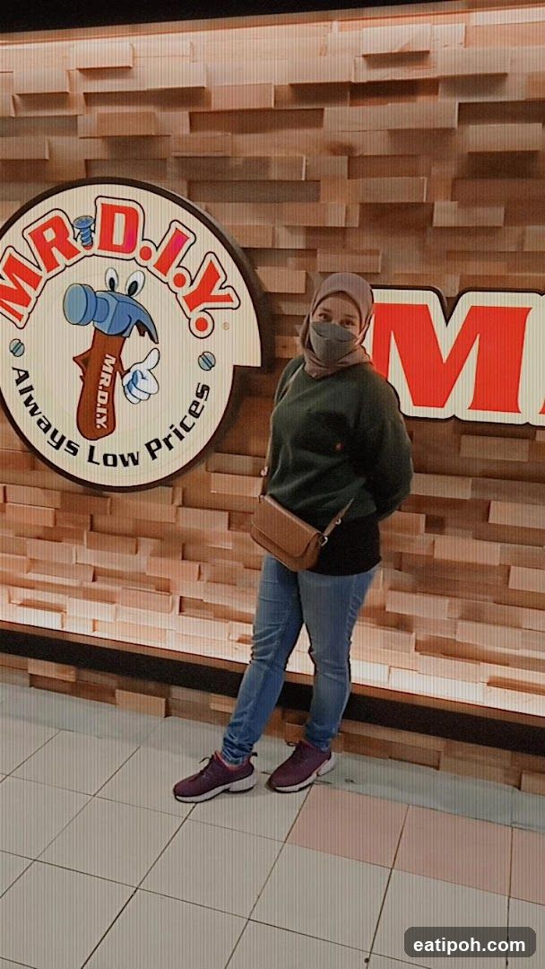 Person at MR.D.I.Y. storefront