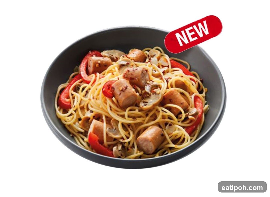 Spaghetti dish with sausages and vegetables