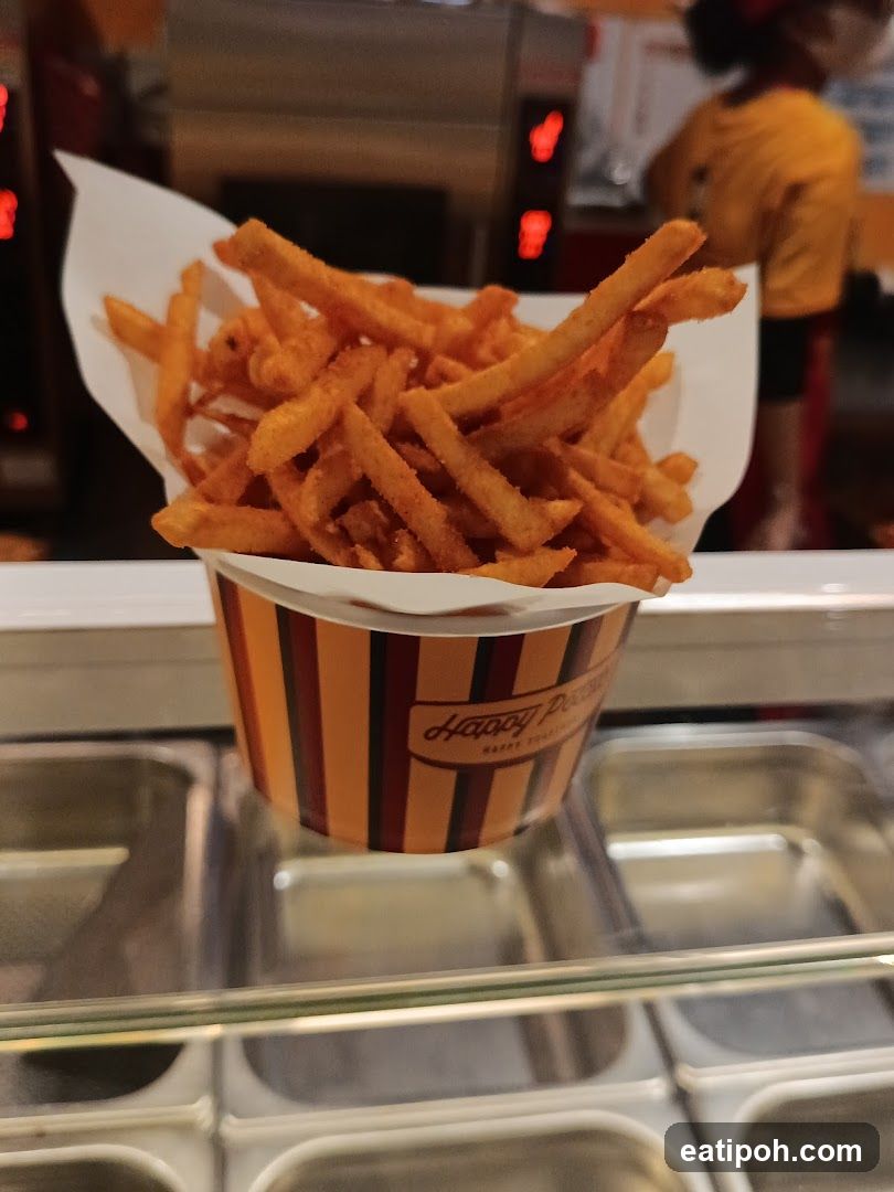 Fries in paper cup at food stall