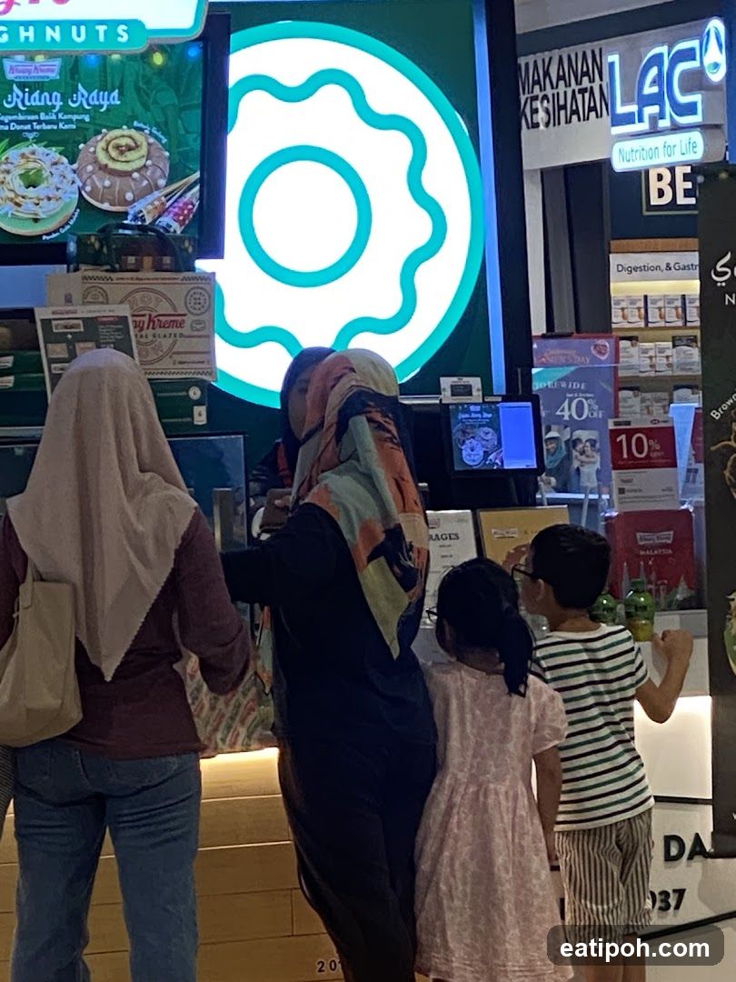 Customers at a food stall inside a shopping mall