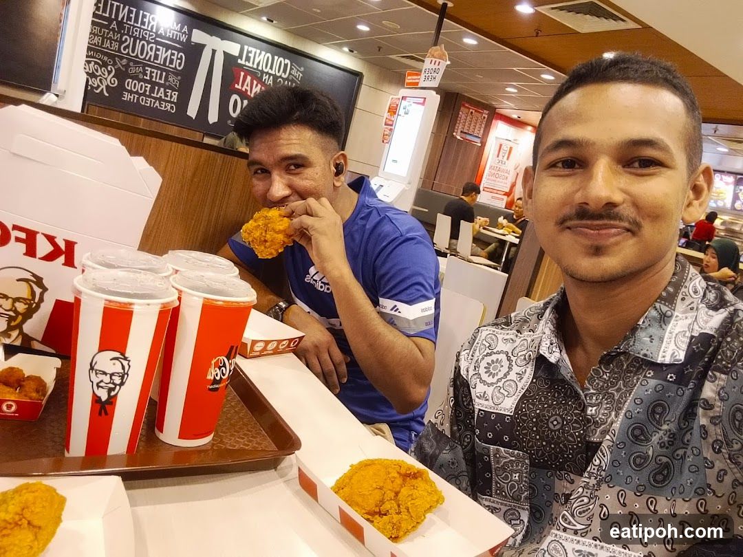 Two men dining at KFC