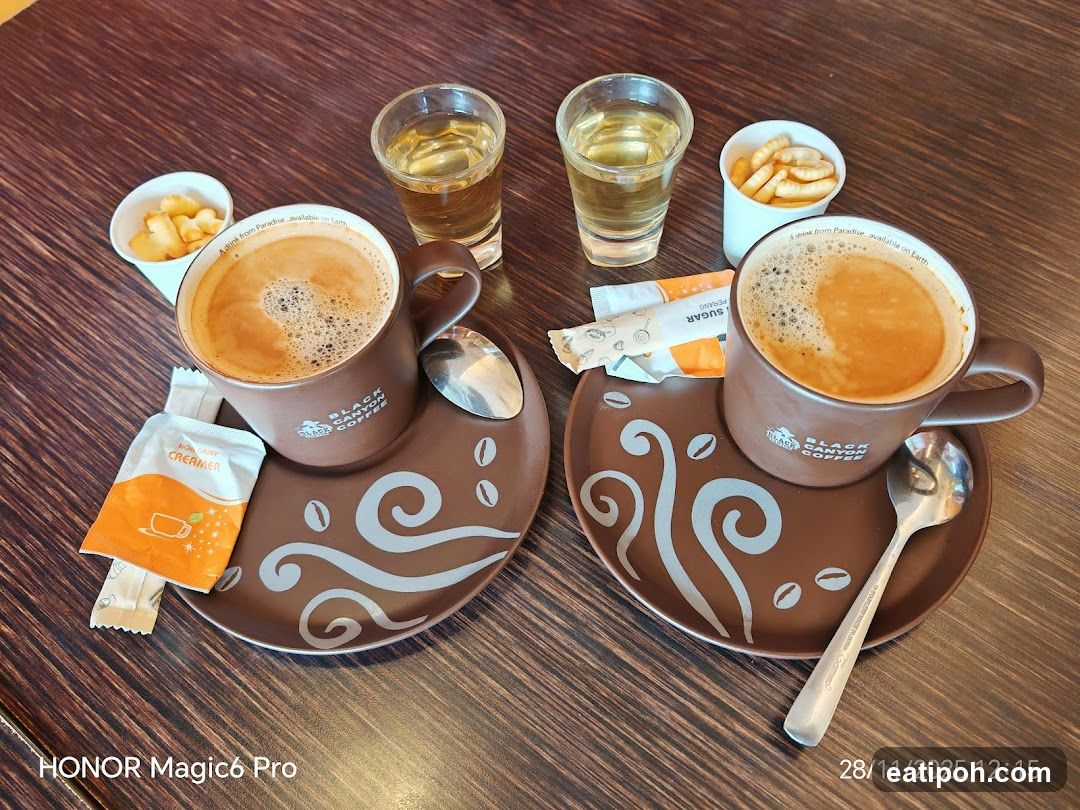 Coffee and snacks on table