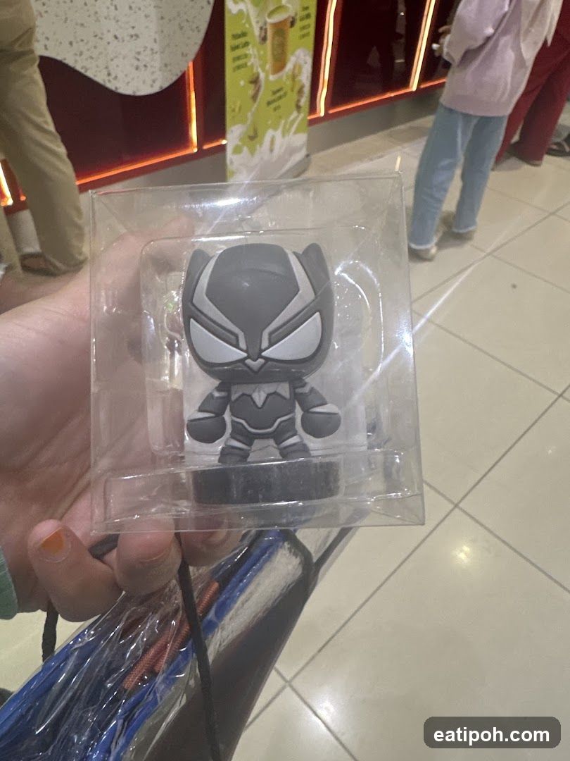 Hand holding a packaged figurine