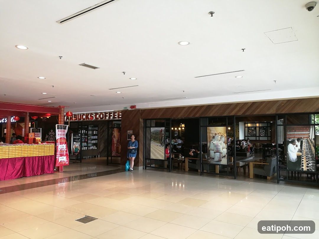 Interior of shopping mall with Starbucks Coffee