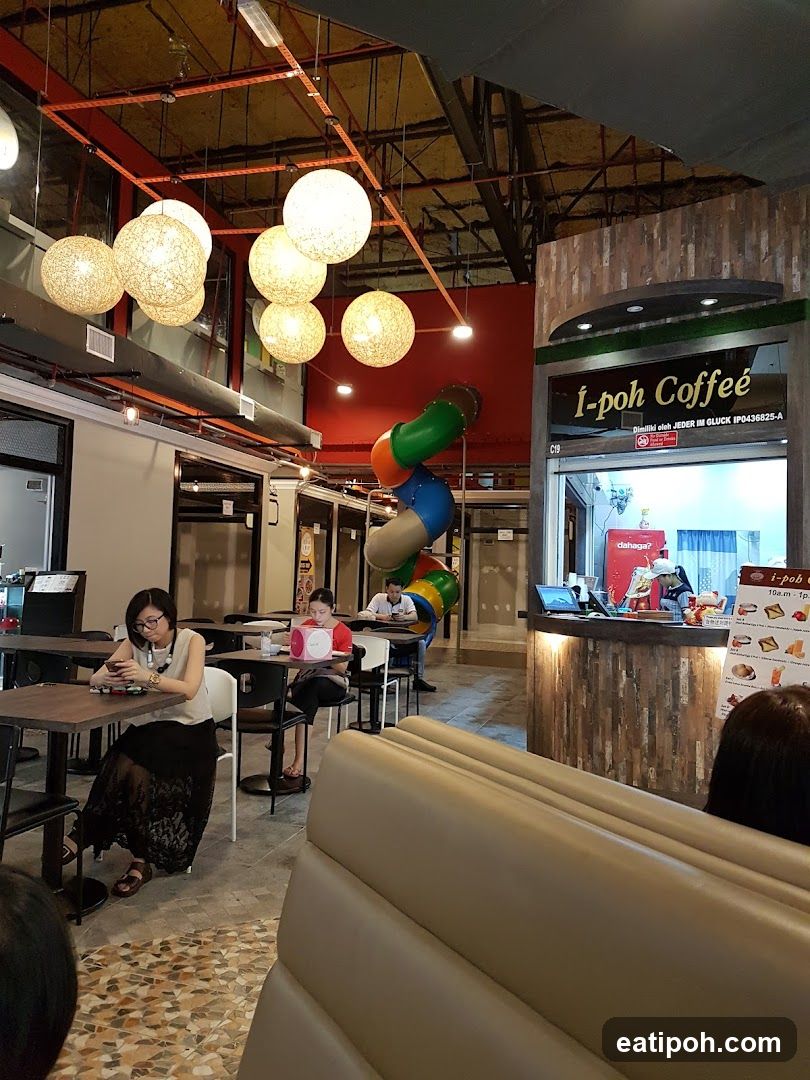 Interior of a café with seating and signage