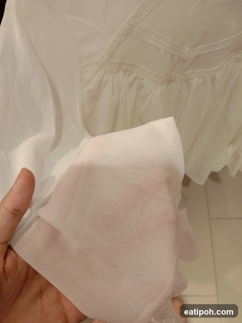 Hand holding fabric