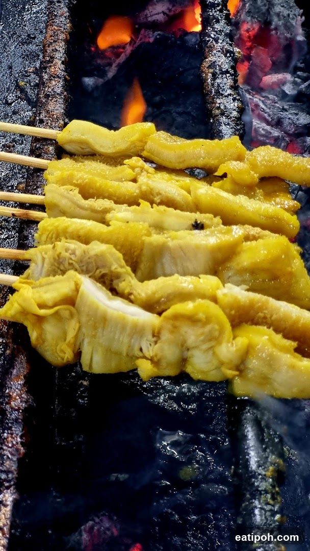 Grilled skewers on charcoal fire