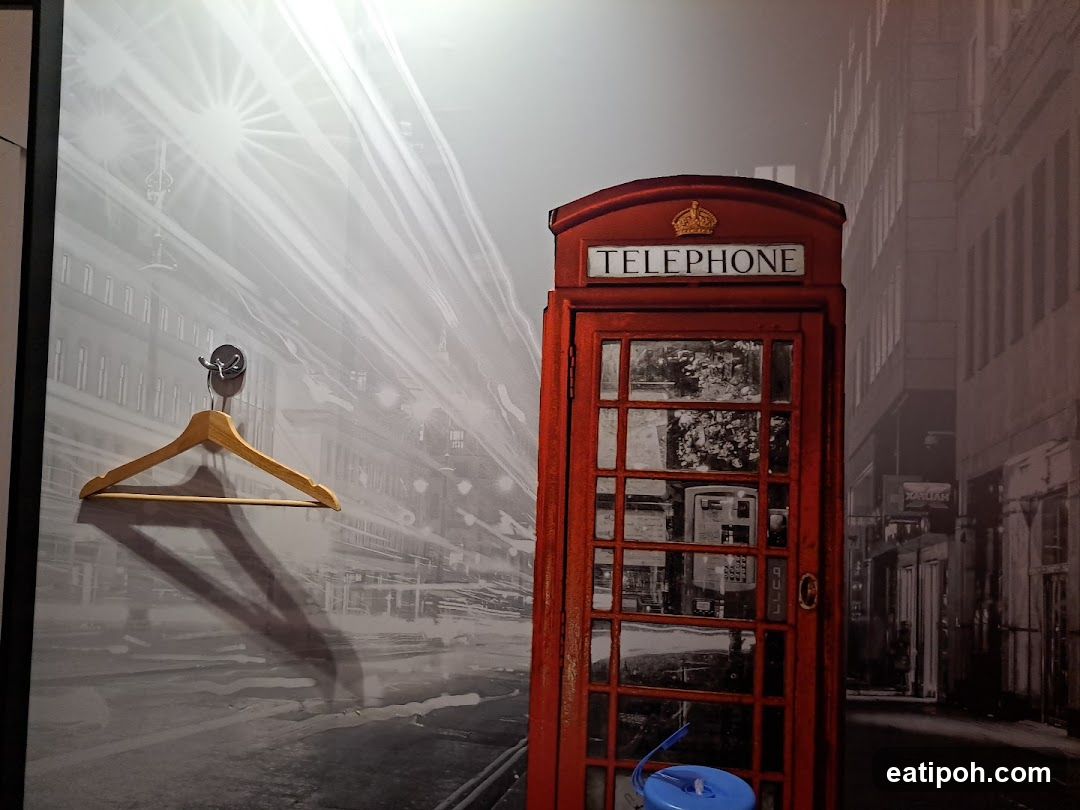 Red Telephone Booth in Urban Setting