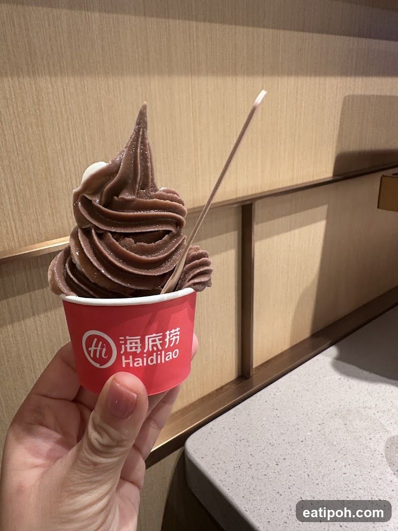 Hand holding Haidilao soft serve